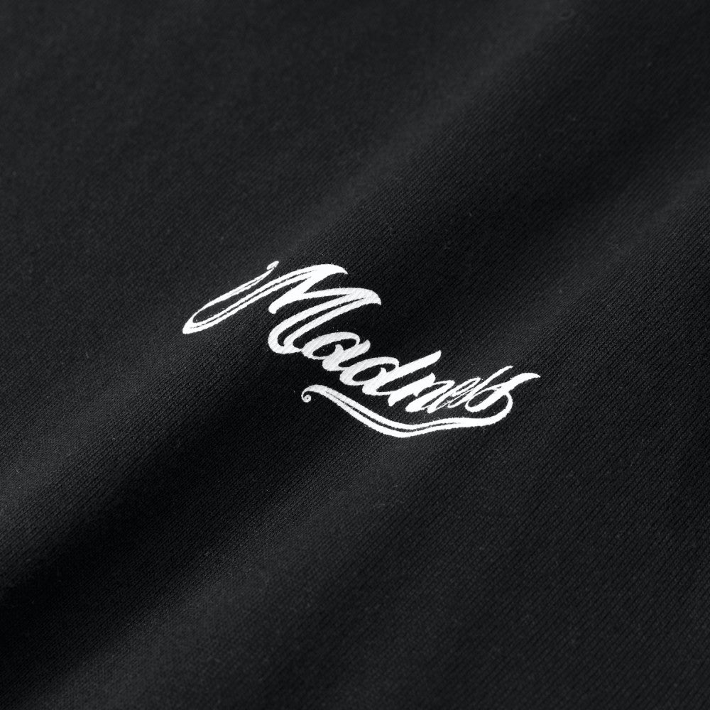 MADNESS BADGE (L) UNIFORM TEE