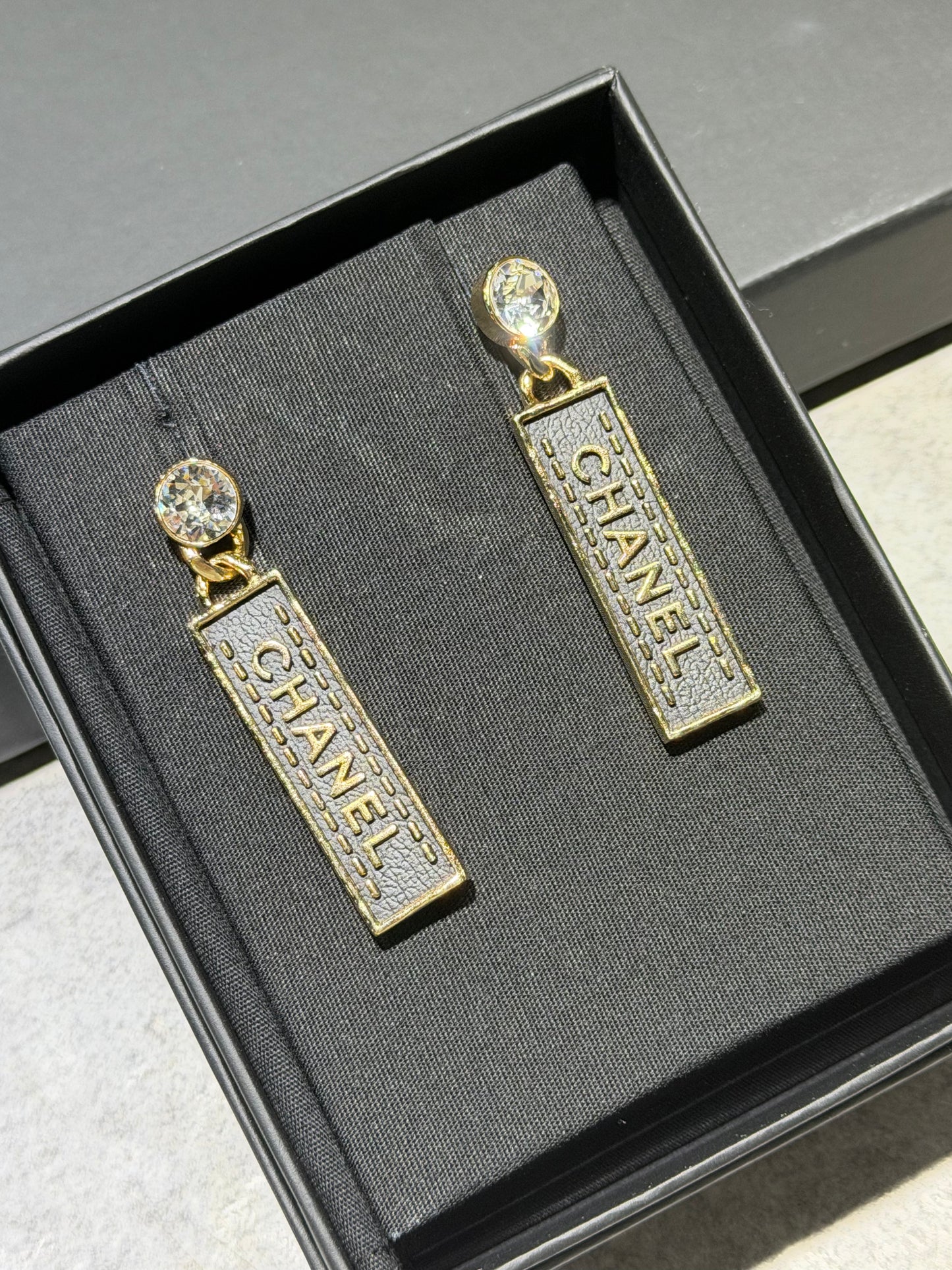 CHANEL CRYSTAL & LEATHER CHANEL LETTER PLAQUE DROP EARRINGS