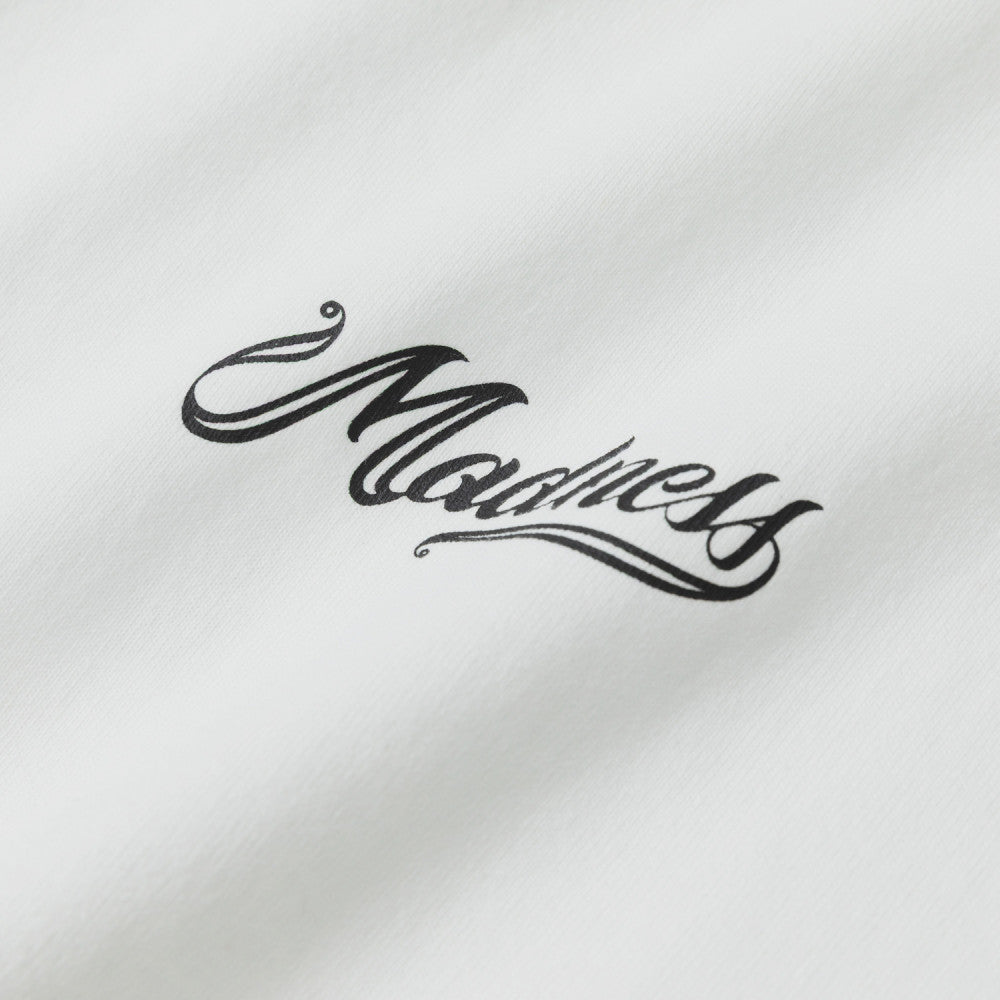 MADNESS BADGE (L) UNIFORM TEE